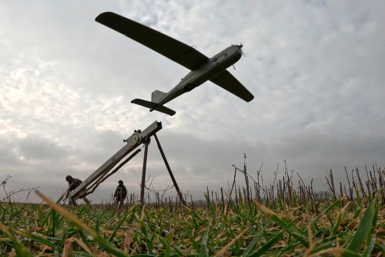 ap26047518751403-1774478861 In this image made from video provided by Russian Defense Ministry Press Service on Sunday, Feb. 15, 2026, shows Russian servicemen launch an Orlan-10 reconnaissance drone for an action in an undisclosed location in Ukraine. (Russian Defense Ministry Press Service via AP)