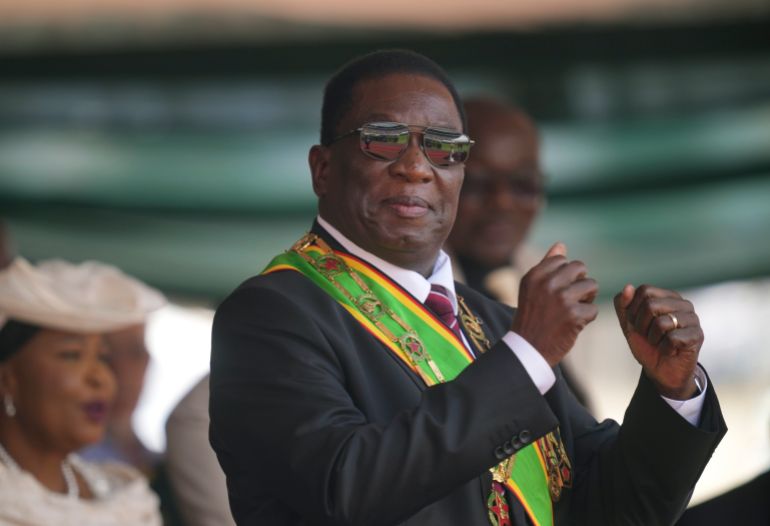 FILE - Zimbabwe President Emmerson Mnangagwa gestures during his inauguration ceremony at the National Sports Stadium in the capital, Harare, on Sept. 4 2023. Zimbabwe police have arrested 18 political activists and hauled some of them off a plane, their lawyers said Thursday, Aug. 1, 2024 in the latest clampdown by the government. (AP Photo /Tsvangirayi Mukwazhi, File)
