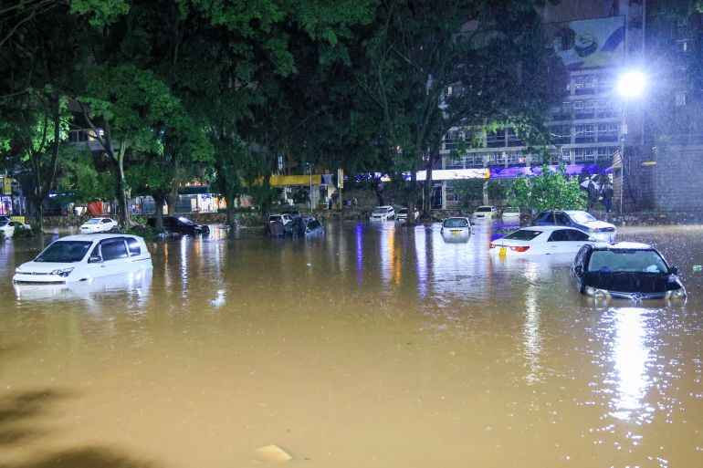 Cars are seen submerged after heavy rains flooded roads in Nairobi, Kenya, on Friday, March 6, 2026. (AP Photo/Andrew Kasuku)
