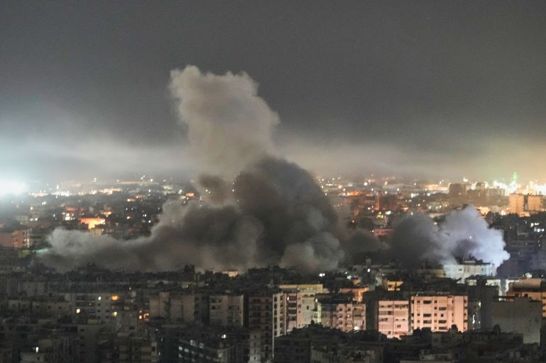 Smoke rises from a building following an Israeli airstrike in Dahiyeh, Beirut's southern suburbs, Lebanon, Wednesday, March 11, 2026. (AP Photo/Bilal Hussein)