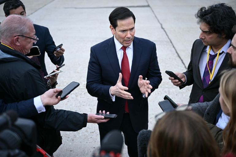 ap_69c73ab852a0e-1774664376 US Secretary of State Marco Rubio, center, gestures as he speaks to the press following a G7 Foreign Ministers' meeting with Partner Countries at the Bourget airport in Le Bourget, outside Paris, Friday, March 27, 2026. (Brendan Smialowski/Pool Photo via AP)