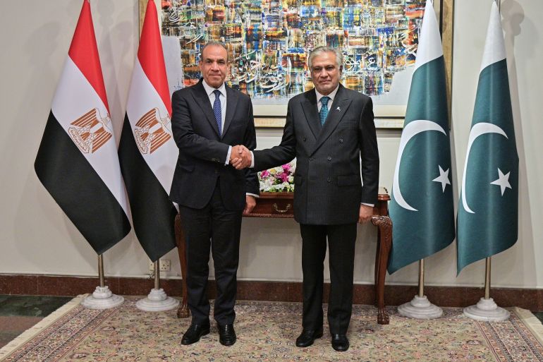 In this photo released by the Pakistan Ministry of Foreign Affairs, Egyptian Foreign Minister Badr Abdelatty, left, shakes hands with Pakistan's Foreign Minister Ishaq Dar prior to their meeting in Islamabad, Pakistan, Sunday, March 29, 2026. (Pakistan Ministry of Foreign Affairs via AP)