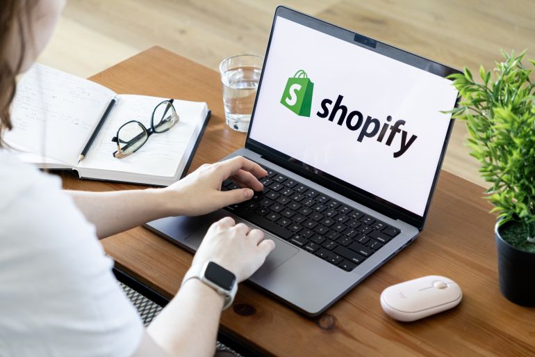 Poznan, Poland - June 15, 2025: Top-down view of Shopify platform application displayed on a laptop screen, with person actively managing e-commerce and online business tasks