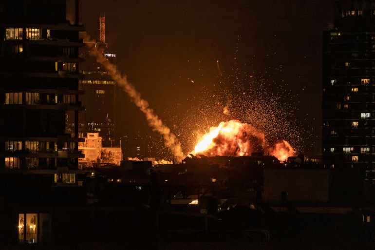 A fireball lights the sky following a missile strike on Tel Aviv on February 28, 2026. The United States and Israel launched strikes against Iran on February 28, with Israel's public broadcaster reporting that the Iranian supreme leader had been targeted, as the Islamic republic retaliated with barrages of missiles at Gulf states and Israel. (Photo by JOHN WESSELS / AFP)