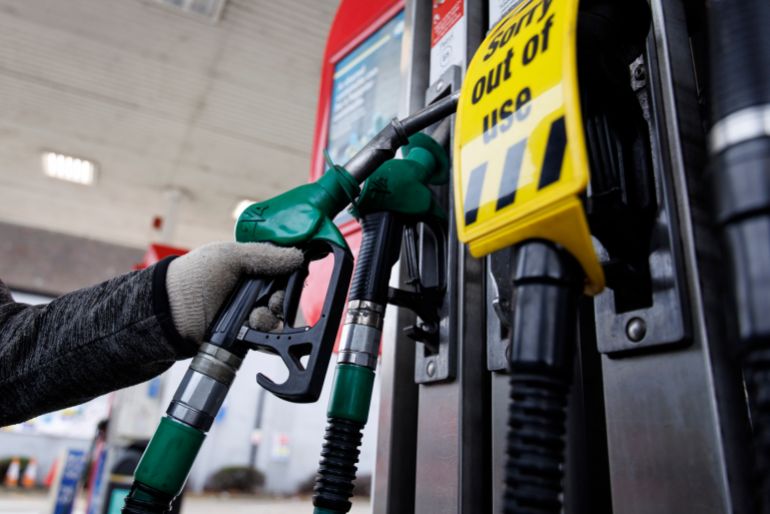 epa12817113 A person handles a fuel pump at a petrol station forecourt in London, Britain, 13 March 2026. Disruptions to oil shipping routes due to the closure of the Strait of Hormuz in the wake of US and Israeli military strikes on Iran and retaliatory attacks by Iran have led to a surge in fuel prices at UK petrol stations. Economists warn that this increase could raise inflation and reduce consumer spending. EPA/TOLGA AKMEN