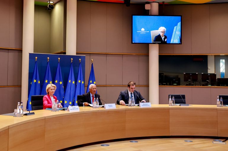 epa12791526 Antonio Costa (C), President of the European Council, receives Ursula von der Leyen (L), President of the European Commission, Kyriakos Pierrakakis (R), President of the Eurogroup, and Christine Lagarde, President of the European Central Bank (on screen online), during an interinstitutional actors meeting in Brussels, Belgium, 03 March 2026. The leaders discussed the European Union's coordinated response to escalating tensions involving Iran. EPA/OLIVIER HOSLET