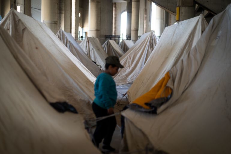 BEIRUT, LEBANON - MARCH 9: A kid walks inside of a shelter on the Camille Chamoun Sports City Stadium on March 9, 2026 in Beirut, Lebanon. The latest escalation in Lebanon has displaced nearly 700,000 people so far, according to the most recent figure reported. Israel has continued its aerial and ground assault in Lebanon after Hezbollah, the Iran-backed militant group in Lebanon, launched missiles at Israel in what it said was retaliation for the joint U.S.-Israeli war on Iran. (Photo by Adri Salido/Getty Images)