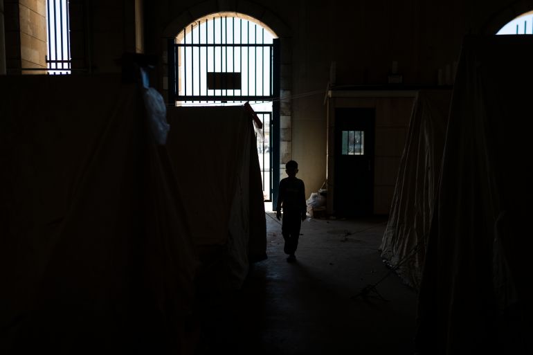 BEIRUT, LEBANON - MARCH 9: A kid walks inside of a shelter on the Camille Chamoun Sports City Stadium on March 9, 2026 in Beirut, Lebanon. The latest escalation in Lebanon has displaced nearly 700,000 people so far, according to the most recent figure reported. Israel has continued its aerial and ground assault in Lebanon after Hezbollah, the Iran-backed militant group in Lebanon, launched missiles at Israel in what it said was retaliation for the joint U.S.-Israeli war on Iran. (Photo by Adri Salido/Getty Images)