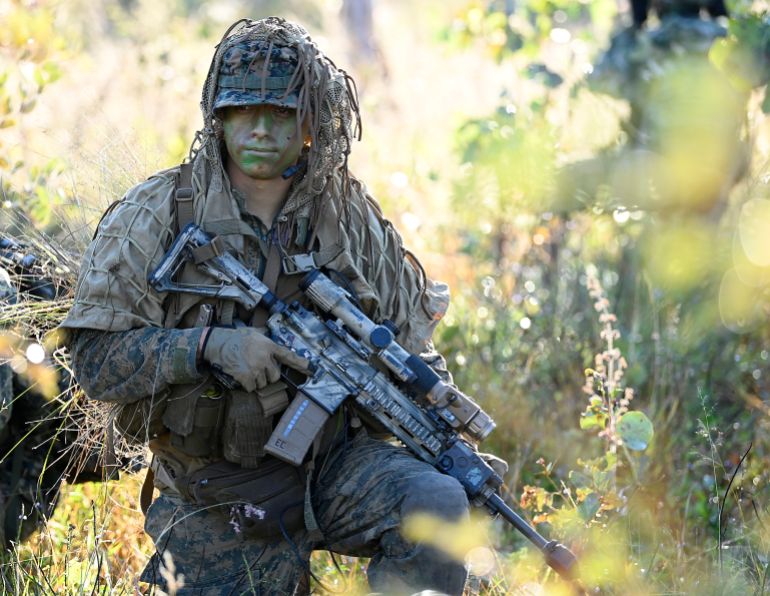BOWEN, AUSTRALIA - JULY 18: A U.S Marine is seen providing reconnaissance before the commencement of an Air Mobile Operation on July 18, 2025 in Bowen, Australia. Over 30,000 military personnel from 19 nations are participating in Exercise Talisman Sabre 2025, the largest-ever joint military drills held across Australia and, for the first time, Papua New Guinea, focusing on multi-domain operations including land, sea, air, space, and cyber warfare. (Photo by Ian Hitchcock/Getty Images)