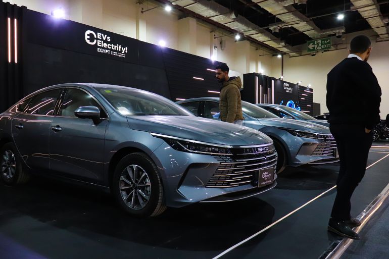 Modern electric vehicles are on display at the second edition of the Cairo Electric Vehicle Exhibition in Cairo, Egypt, on December 18, 2025. (Photo by Ahmed Mosaad/NurPhoto via Getty Images)