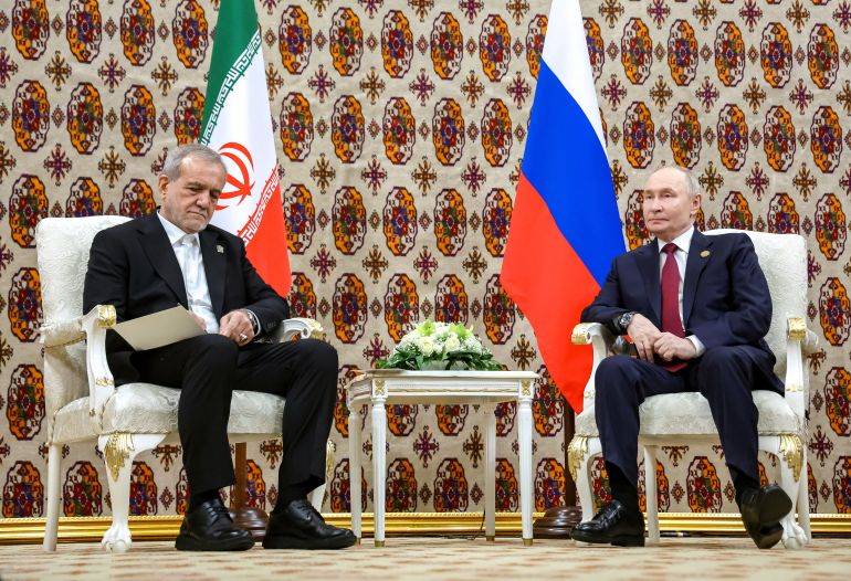 بوتين و بزشكيان Russian President Vladimir Putin and Iranian President Masoud Pezeshkian attend a meeting in Ashgabat, Turkmenistan December 12, 2025. Sputnik/Alexander Kazakov/Pool via REUTERS ATTENTION EDITORS - THIS IMAGE WAS PROVIDED BY A THIRD PARTY.