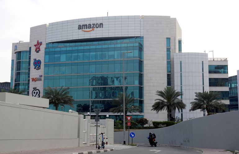 أمازون دبي A delivery personnel rides a motobike, with the Amazon sign displayed on a building, amid the U.S.-Israel conflict with Iran, in Dubai, United Arab Emirates, March 7, 2026. REUTERS/Amr Alfiky