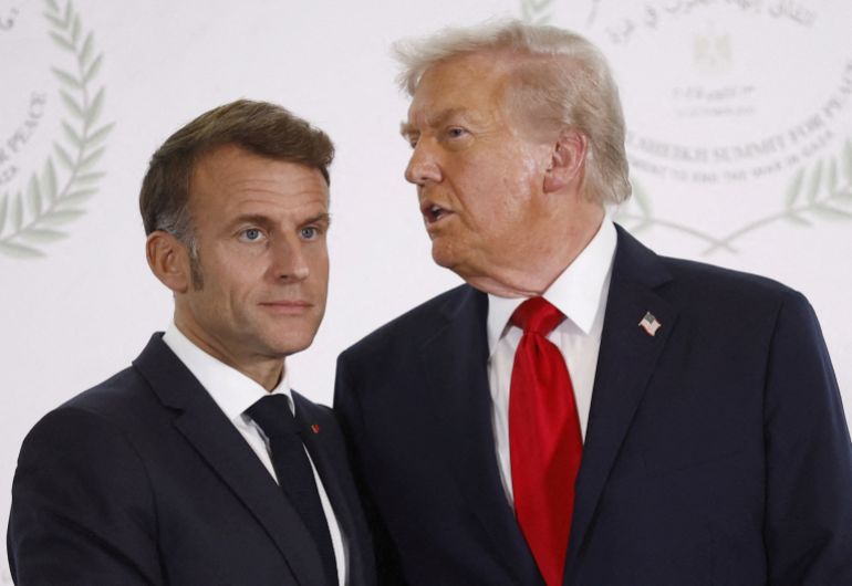 reuters_696fc4fb-1768932603 FILE PHOTO: U.S. President Donald Trump speaks to French President Emmanuel Macron as they pose for a photo, at a world leaders' summit on ending the Gaza war, amid a U.S.-brokered prisoner-hostage swap and ceasefire deal between Israel and Hamas, in Sharm el-Sheikh, Egypt, October 13, 2025. Yoan Valat/Pool via REUTERS/File Photo
