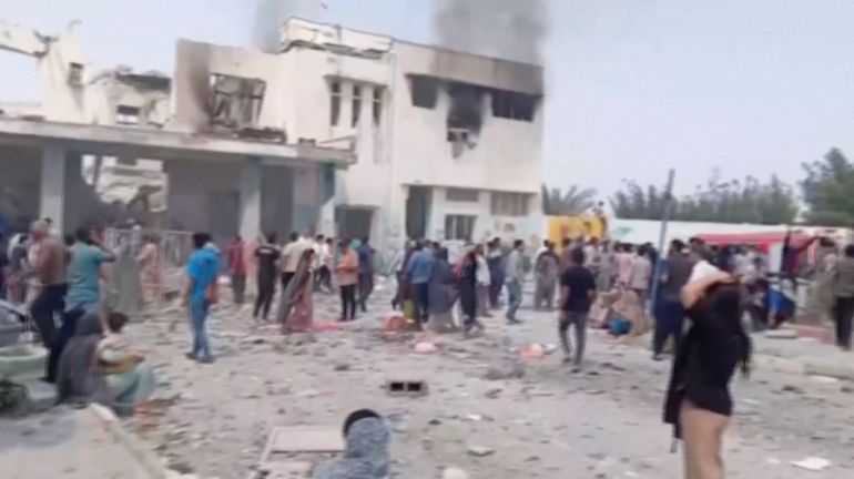 reuters_69a32748-1772300104-1 Black smoke rises from a destroyed building at a school where, as the state media reports, several people were killed in an Israeli airstrike, following strikes by the United States and Israel against Iran, in Minab, Iran in this screengrab obtained from a social media video released on February 28, 2026. Social Media/via Reuters TV/via REUTERS THIS IMAGE HAS BEEN SUPPLIED BY A THIRD PARTY. NO RESALES. NO ARCHIVES. NEWS USE ONLY. BEST QUALITY AVAILABLE. VERIFICATION: -Building, curb, road layout, wall, trees and utility pole matched satellite imagery -Coordinates: 27.109684199332207, 57.08493282609587 -Exact date not verified, but no earlier version of the videos was found posted online before February 28 -Iranian state media reported on February 28 that Israel struck a school in southern Iran, resulting in 40 deaths. -The website of the school has an address that matches the coordinates