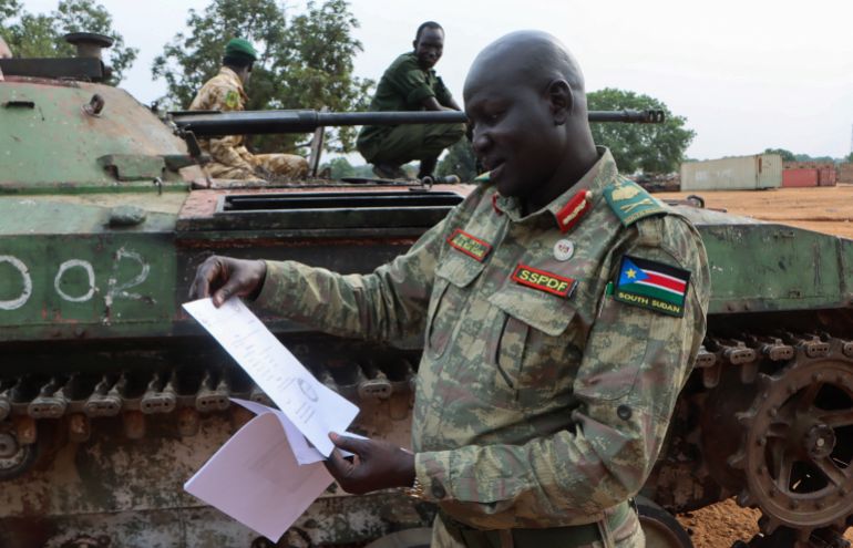 Major General Lul Ruai Koang, spokesperson for the South Sudan People's Defence Forces (SSPDF), shows journalists a captured BMP-2 infantry fighting vehicle nicknamed “Boorchar” seized by Sudan People's Liberation Movement-in-Opposition (SPLA-IO) fighters from an Indian peacekeeping unit serving under the United Nations Mission in South Sudan (UNMISS) during the 2013 conflict, after a press conference on the military operations in Akobo and ordering the withdrawal of UNMISS from the area; at the SSPDF armoury barracks in Juba, South Sudan March 6, 2026. REUTERS/Samir Bol