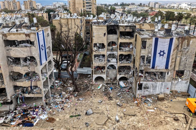 reuters_69c692f1-1774621425 A drone view shows damage in a residential neighbourhood, following a night of Iranian missile strikes which injured dozens of Israelis, amid the U.S.-Israel conflict with Iran, in Arad, southern Israel March 26, 2026. REUTERS/ Ilan Rosenberg