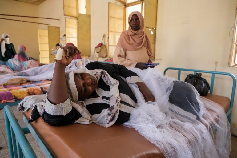 reuters_69c696db-1774622427 FILE PHOTO: Sudanese women lie in beds as they receive treatment for dengue fever at Omdurman Hospital, as Sudan grapples with outbreaks of dengue and cholera amid the annual rainy season and a collapsed healthcare and infrastructure system, in Khartoum, Sudan, September 23, 2025. REUTERS/El Tayeb Siddig/File Photo