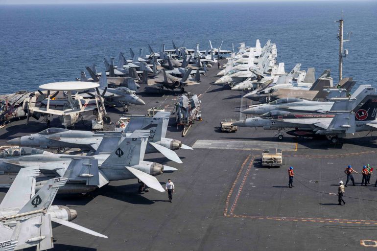 U.S. Navy and U.S. Marine Corps aircraft attached to Carrier Air Wing (CVW) 9 are arrayed on the flight deck of the Nimitz-class aircraft carrier USS Abraham Lincoln during the Operation Epic Fury attack on Iran from an undisclosed location March 10, 2026. U.S. Navy/Handout via REUTERS THIS IMAGE HAS BEEN SUPPLIED BY A THIRD PARTY