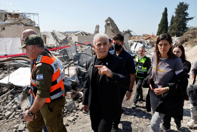 Israeli opposition leader Yair Lapid visits the site of a fatal Iranian missile strike, amid the U.S.-Israel conflict with Iran, in Beit Shemesh, Israel, March 2, 2026. REUTERS/Amir Cohen