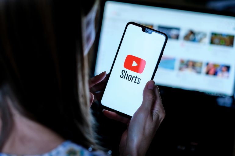 shutterstock_1814846240-1768564798 Stafford / United Kingdom - September 14 2020: Youtube Shorts app logo seen on the smartphone which hold by young girl. It is a new short looping video app, competitor to TikTok, Bytes and Reels.
