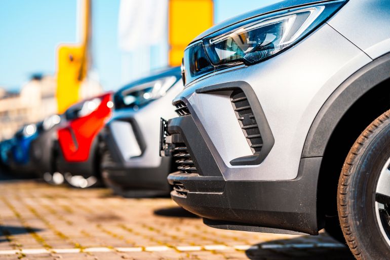 Cars for sale. Dealer inventory. Rows of brand new vehicles awaiting new owners; Shutterstock ID 2261567673; purchase_order: aj; job: ; client: ; other: