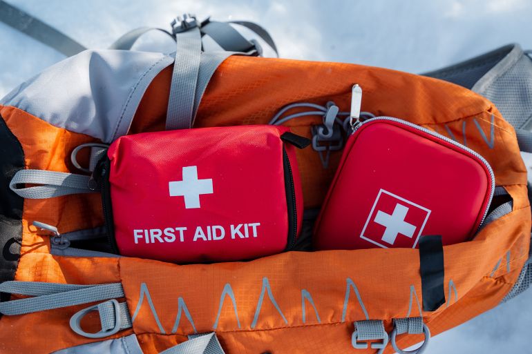 This first aid kit is thoughtfully packed in a vibrant bright orange backpack, which is designed for convenient and quick access during emergencies at home or while engaging in outdoor activities; Shutterstock ID 2596508717; purchase_order: aj; job: ; client: ; other: