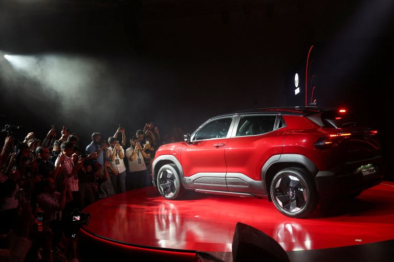 Media surround the Toyota Urban Cruiser Ebella electric vehicle during a launch event in Mumbai, India, January 20, 2026. REUTERS/Francis Mascarenhas