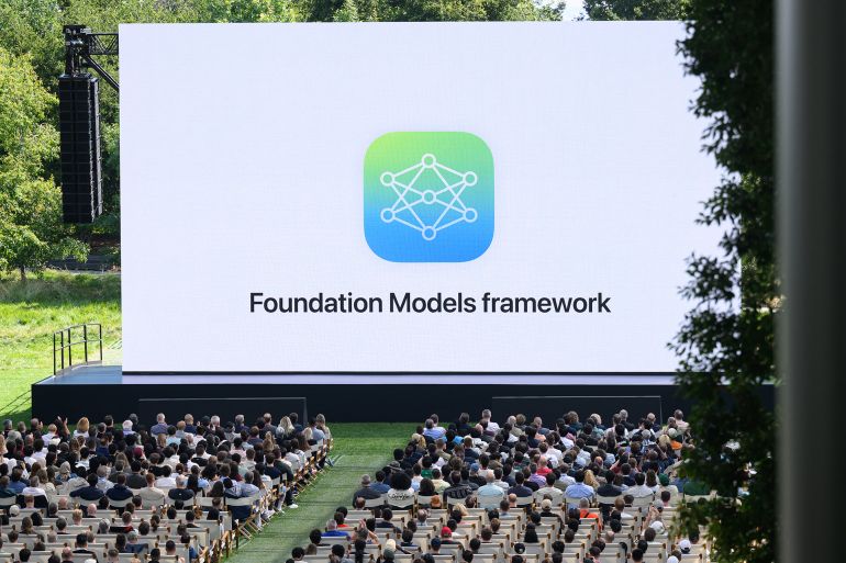 Apple announces upgrades to their AI system, "Apple Intelligence," during the annual Apple "Worldwide Developers Conference" (WWDC) at Apple Park, the corporate headquarters of Apple Inc., in Cupertino, California on June 9, 2025. Pressure is on Apple to show it hasn't lost its magic despite broken promises to ramp up iPhones with generative artificial intelligence (GenAI) as rivals race ahead with the technology. Apple will showcase plans for its coveted devices and the software powering them at its annual Worldwide Developers Conference (WWDC) kicking off Monday in Silicon Valley and running through June 13. (Photo by Josh Edelson / AFP)