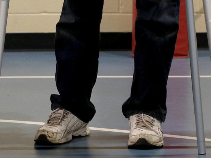 1b6d94a0-ae20-4c59-a366-1bf83d0682f1 Roopert, a one and a half year old platinum golden retriever service companion, looks up at his owner Tim Nicholson, 54 of Farmington Hills, Mich., as Nicholson votes at Precinct 20 on Election Day a the Salvation Army in Farmington Hills, Mich., Tuesday, Nov. 4, 2014. Nicholson has Parkinson's disease and uses Roopert for help with various things. (AP Photo/Detroit Free Press, Eric Seals) DETROIT NEWS OUT, TV OUT, MAGS OUT, NO SALES, MANDATORY CREDIT