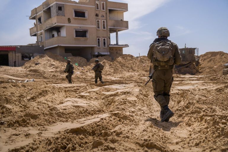 A picture released by the Israeli Army says to show Israeli soldiers conducting operations in a location given as Tel Al-Sultan area, Rafah Governorate, Gaza, in this handout image released April 2, 2025. Israeli Army/Handout via REUTERS THIS IMAGE HAS BEEN SUPPLIED BY A THIRD PARTY