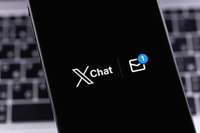 X Chat logo mobile app on a screen smartphone iPhone closeup. X Chat is a new messenger from Elon Musk, integrated into the X (Twitter). Batumi, Georgia - November 21, 2025