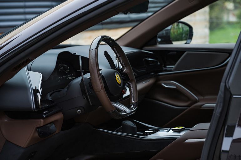 Slovenia, Ljubljana - 6 November 2024: Black Ferrari Purosangue luxury sports car interior