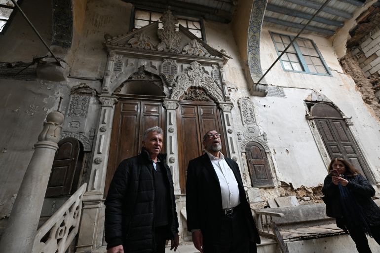 465-1776831524 Syrian US-based rabbi Youssef Hamra (C) tours the Ifrange Synagogue in the Jewish quarter of Damascus' Bab Sharqi district, on February 19, 2025. Since the fall of Bashar al-Assad, Syria's new rulers have repeatedly sought to reassure minorities that they will not be harmed, with the international community also urging them to protect the country's diverse communities. (Photo by LOUAI BESHARA / AFP)