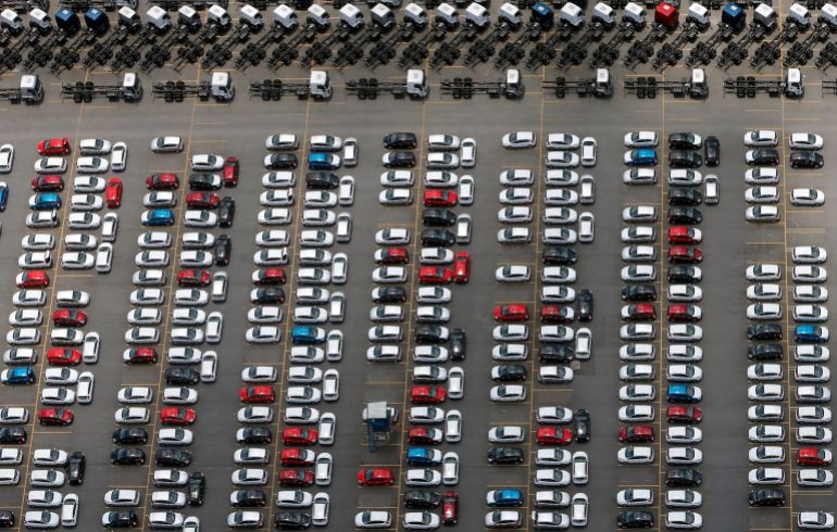 New Ford vehicles and trucks are seen at a parking lot of the Ford factory in Sao Bernardo do Campo February 12, 2015. Automobile sales in Brazil this year are expected to post their biggest drop in 16 years, underscoring the depths of an industry crisis that has triggered layoffs and trade tensions, national dealership association Fenabrave said on March 3, 2015. New registrations are expected to fall 10 percent from a year earlier and could reach their lowest level since 2009, following steep drops in January and February.Sales of cars, trucks and buses tumbled 28 percent in February from January, Fenabrave reported on Tuesday. January sales had plunged 31 percent from December. Brazilian consumer and business confidence is crumbling as rising interest rates and accelerating inflation squeeze household budgets, choking off one of the few sources of economic growth in recent years. Picture taken February 12, 2015. REUTERS/Paulo Whitaker (BRAZIL - Tags: TRANSPORT POLITICS BUSINESS)