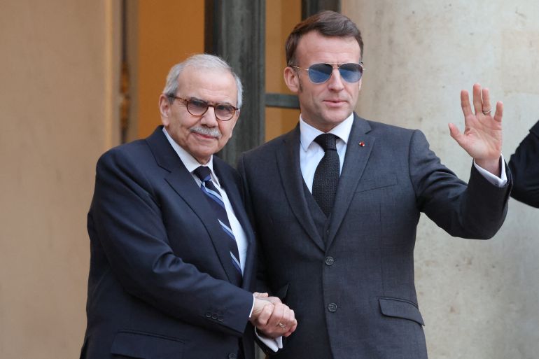 afp_697432b5c7d5-1769222837 France's President Emmanuel Macron (R) wearing sunglasses shakes hands with Lebanon's Prime Minister Nawaf Salam prior to their meeting at the Elysee presidential palace in Paris, on January 23, 2026. (Photo by Ludovic MARIN / AFP)