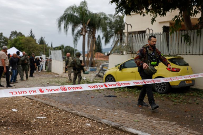 afp_69ce83489466-1775141704 Israeli security forces gather at the site of a Hezbollah missile strike that targeted a house in the northern Israeli town of Kiryat Shmona near the border with Lebanon on April 1, 2026.