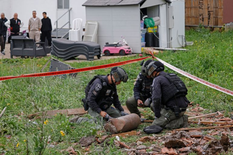 afp_69ce87a7f3f9-1775142824 Israeli security forces gather at the site of a Hezbollah missile strike that targeted a house in the northern Israeli town of Kiryat Shmona near the border with Lebanon on April 1, 2026.