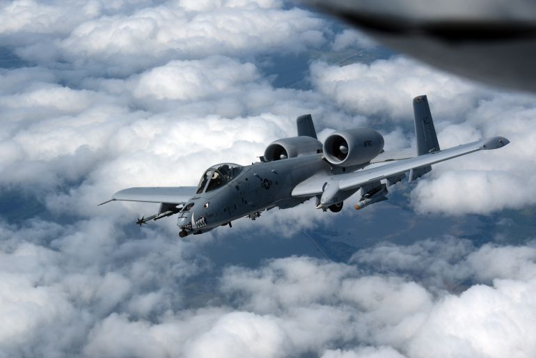 afp_69d0199391c7-1775245715 A US Air Force A-10 Thunderbolt II, also known as the Warthog, departs after receiving fuel in the skies near the border of Iowa and Missouri on July 7, 2020.