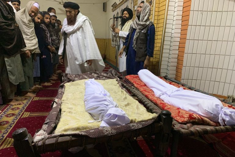 EDITORS NOTE: Graphic content / Afghan mourners offer funeral prayers for victims who died after a roof of a house collapsed due to rainfall in Jalalabad on April 3, 2026.
