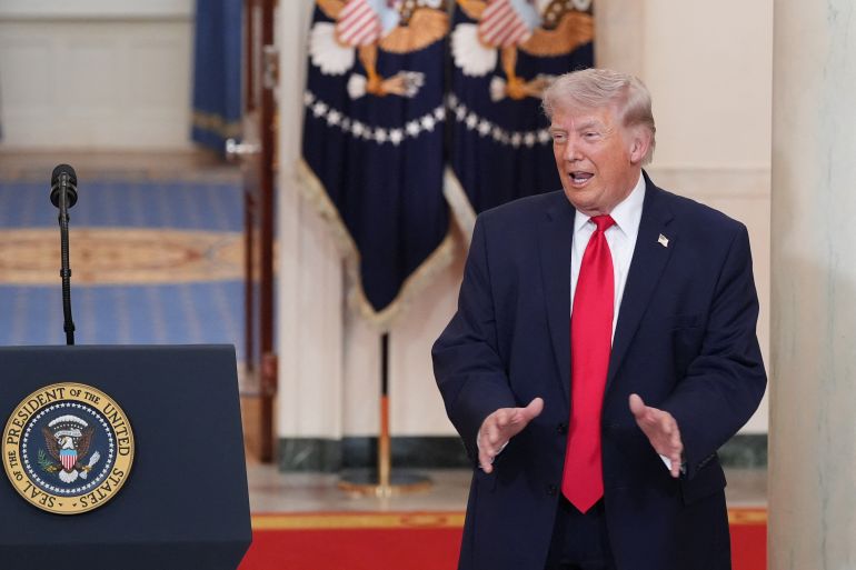 afp_69d230e70f0c-1775382759-1 US President Donald Trump gestures after speaking at a televised address on the conflict in the Middle East from the Cross Hall of the White House in Washington, DC on April 1, 2026.