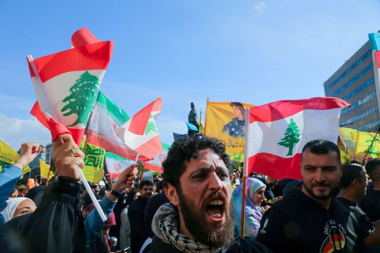Hezbollah supporters, some waving the Lebanese flag, demonstrate near the Governmental Palace to protest the Lebanese authorities’ decision to engage in direct negotiations with Israel to end the ongoing war, in downtown Beirut on April 11, 2026.