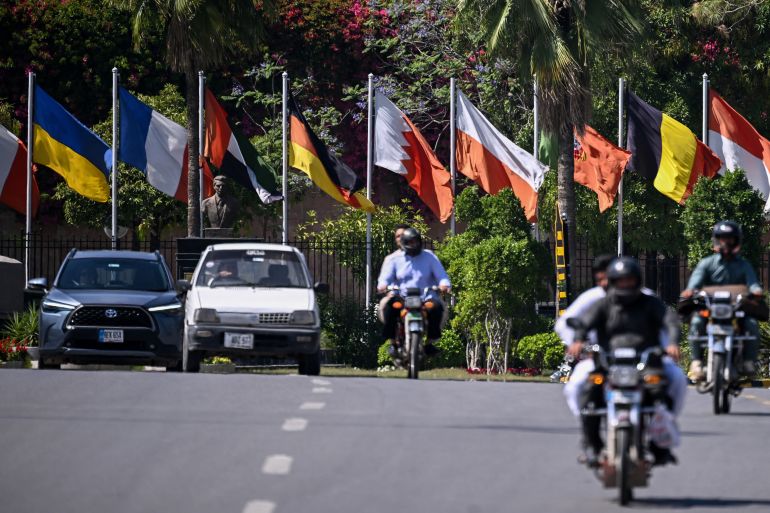 afp_69df31772bf0-1776234871 Motorists ride past Serena Hotel, the venue where Iran and the United States held peace talks earlier in Islamabad on April 14, 2026.