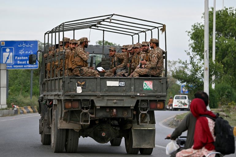 Army personnel patrol a street near the Serena Hotel, that hosted the first round of US-Iran negotiations during the Middle East war, at the Red Zone area in Islamabad on April 21, 2026, amid heightened security measures ahead of anticipated second round of US-Iran peace talks.