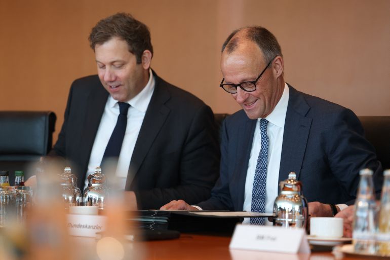 afp_69e9cb08191d-1776929544 German Finance Minister and Vice Chancellor Lars Klingbeil (L) and Germany's Chancellor Friedrich Merz have taken their seats for the weekly cabinet meeting at the Chancellery in Berlin on April 22, 2026. (Photo by Odd ANDERSEN / AFP)