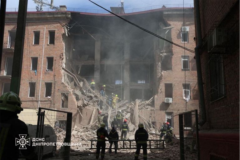 afp_69ed3eeb807d-1777155819 This handout photograph taken and released by the State Emergency Service of Ukraine on April 25, 2026 shows Ukrainian rescuers clearing debris in a building following a Russian attack in Dnipro, amid the Russian invasion of Ukraine.