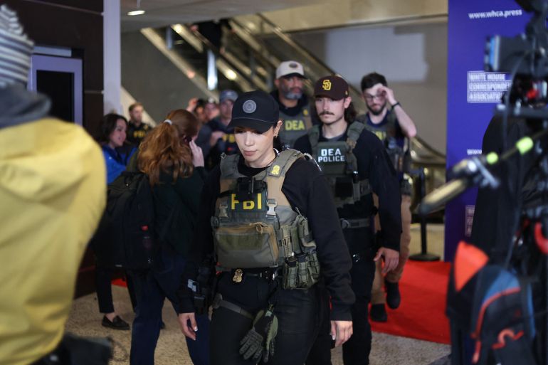 FBI agents are seen at the Washington Hilton after shots were fired during the White House Correspondents dinner at the Washington Hilton in Washington, DC, on April 25, 2025.