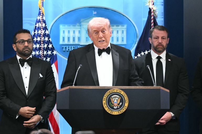 US President Donald Trump speaks, flanked by FBI Director Kash Patel and US Secretary of Homeland Security Markwayne Mullin, during a press briefing in the Brady Briefing Room at the White House in Washington, DC, shortly after a shooting incident at the White House Correspondents’ Dinner on April 25, 2026.