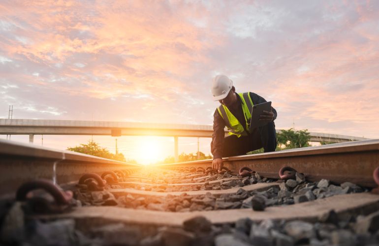ahmed1-1777459589 Asian engineer inspects trains Construction workers on the railway Engineer working on railway depot maintenance