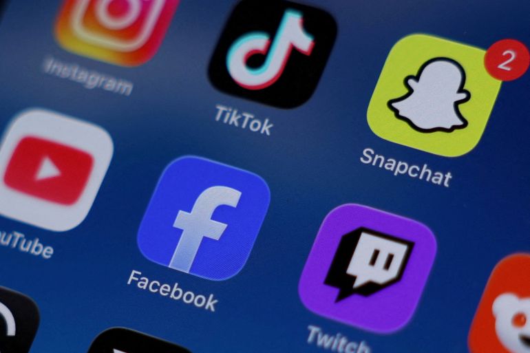 FILE PHOTO: Instagram, TikTok, Snapchat, YouTube, Facebook, Twitch and Reddit applications are displayed on a mobile phone ahead of new law banning social media for users under 16 in Australia, in this picture illustration taken on December 9, 2025. REUTERS/Hollie Adams/Illustration/File Photo