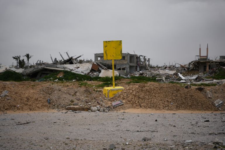 A yellow block demarcating the "Yellow Line," which has separated the Gaza Strip's Israeli-held and Palestinian zones since the October ceasefire, is visible in Khan Younis, southern Gaza Strip, Thursday, Jan. 22, 2026. (AP Photo/Abdel Kareem Hana)
